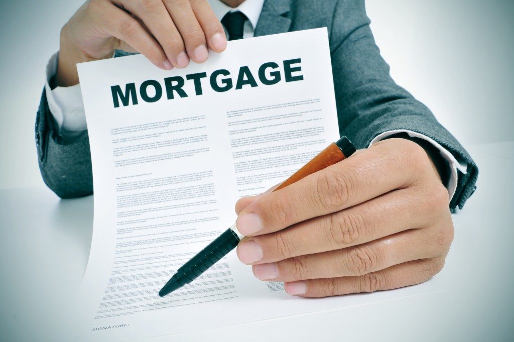 man showing a mortgage loan contract
