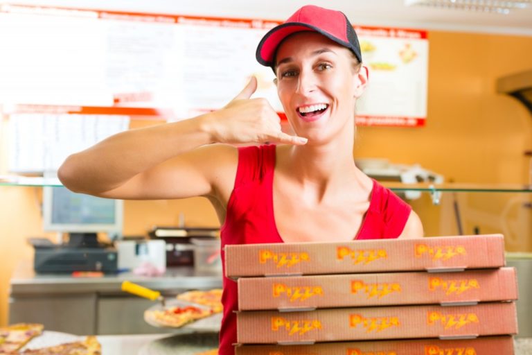 Man carrying pizza boxes