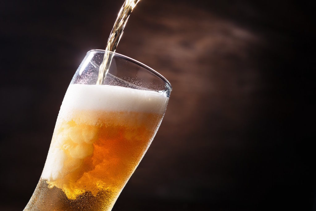 Beer being poured into glass