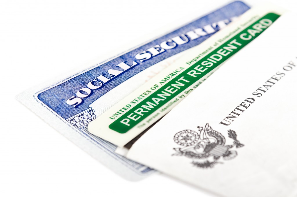 social security and green card on white background
