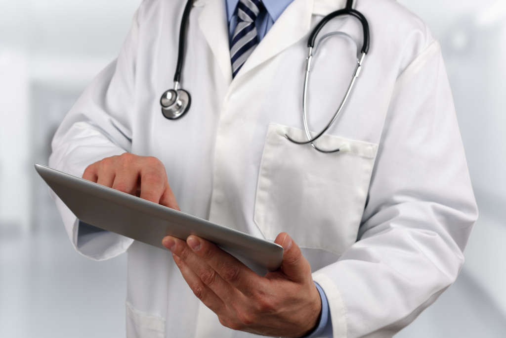 Doctor in hospital using a digital tablet